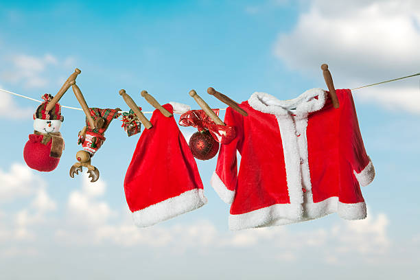 The image shows Christmas themed clothes drying on a clothesline. 